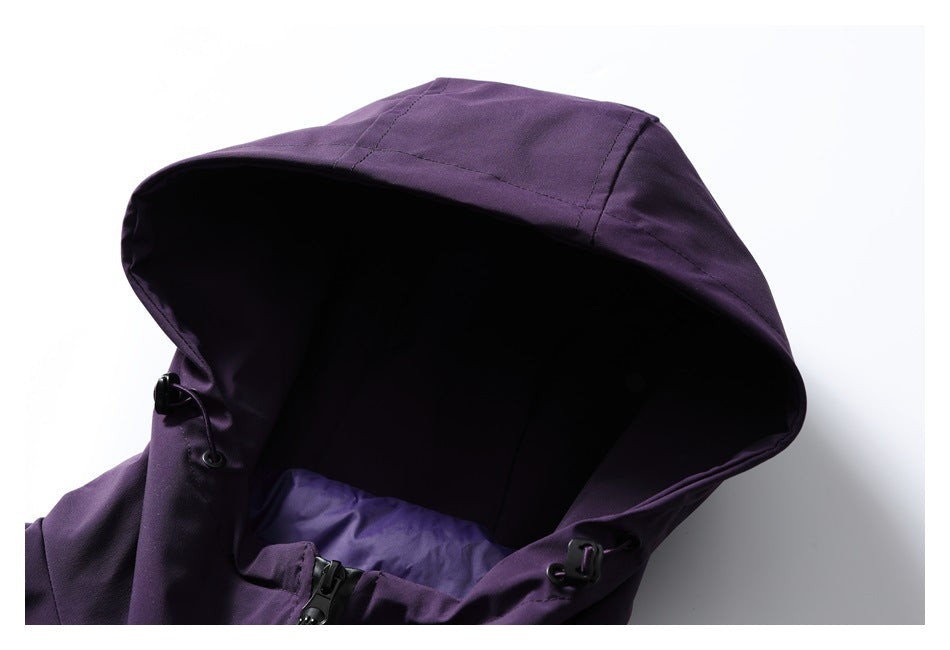 Close-up of the purple jacket's hood, lining, drawcord hardware, and front zipper.