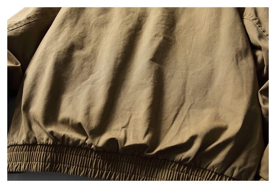 Close-up of the tan-brown garment's lower edge with a wide gathered elastic hem.