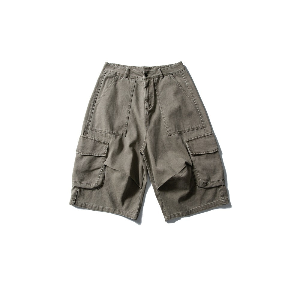 Green cargo shorts flat lay with front patch pockets, side flap cargo pockets and button zip fly