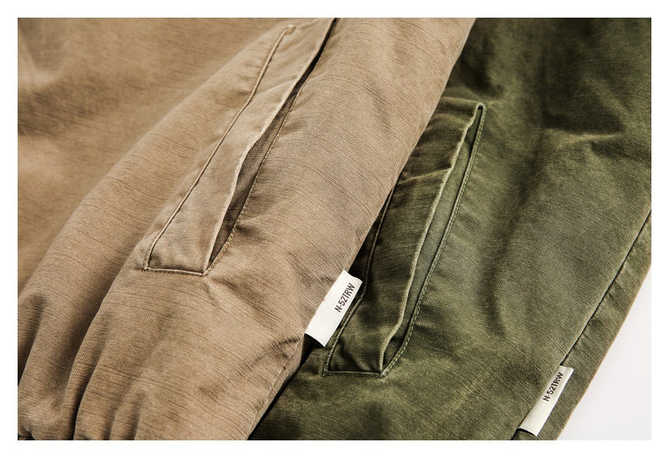 Tan and olive garments shown with slim pocket openings and small sewn labels.