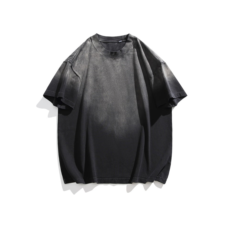 Black short-sleeve crewneck T-shirt with faded gray gradient wash, flat lay front view