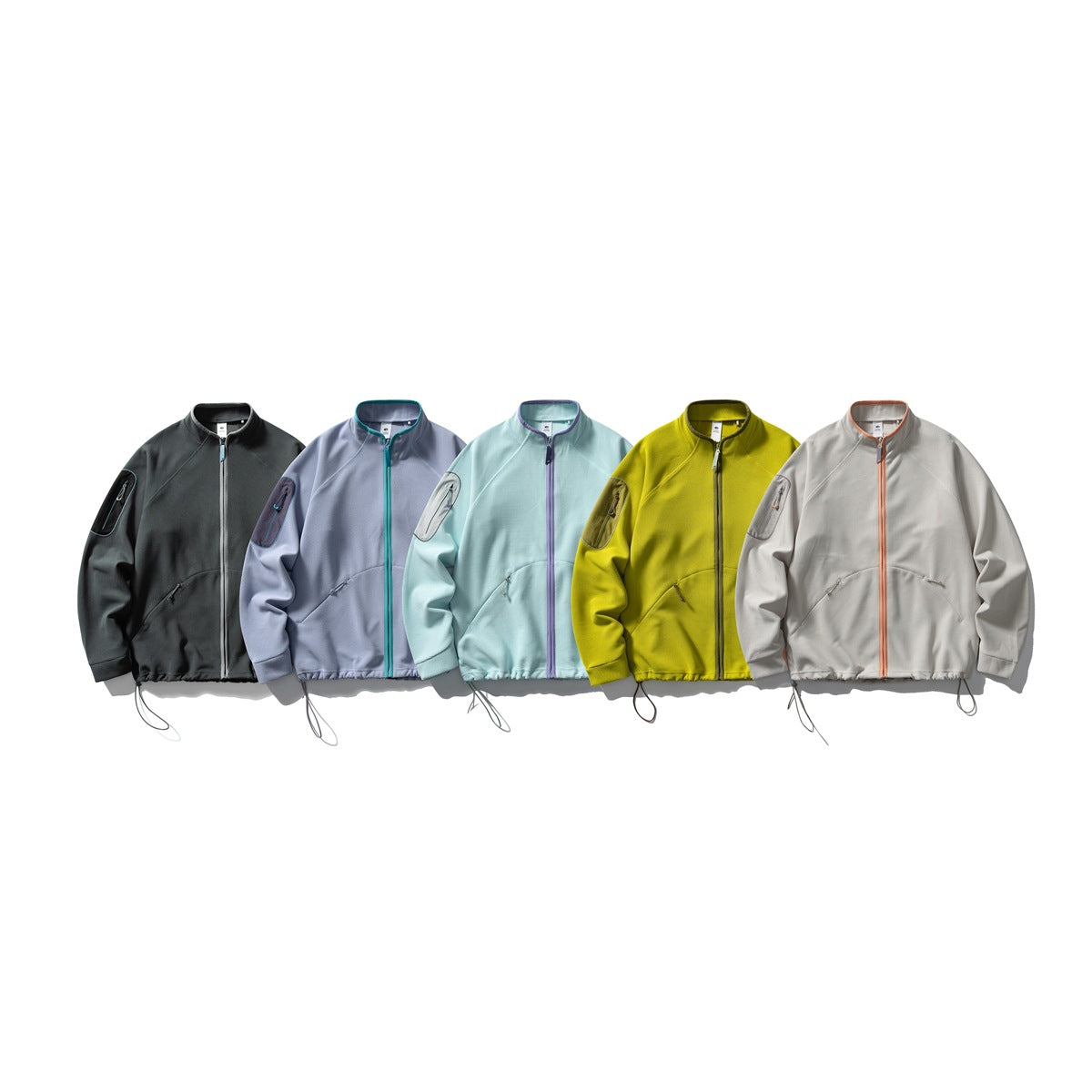 Five front-view zip jackets shown in charcoal, lavender, pale aqua, yellow-green and light gray.
