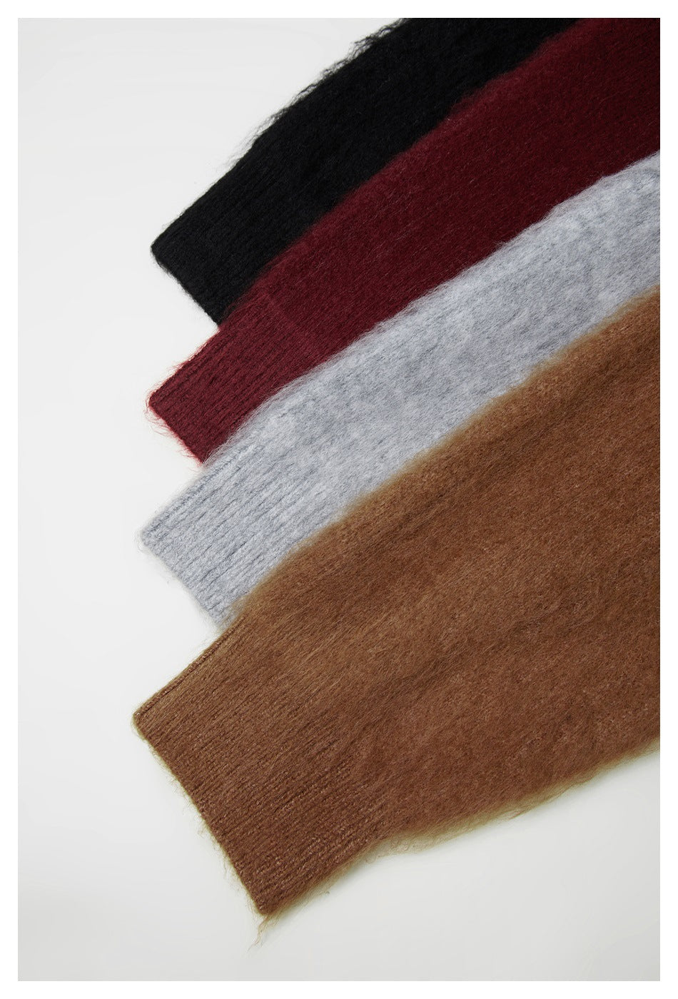 Close-up of fuzzy knit garment sections in black, burgundy, light gray, and brown, arranged diagonally.