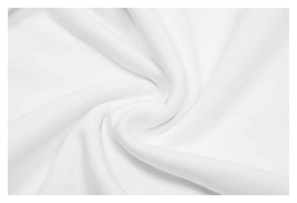 Close-up of smooth white fabric arranged in soft folds.