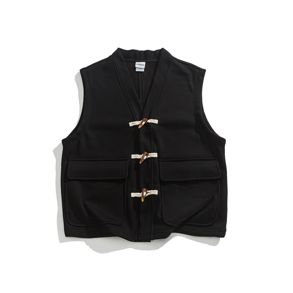 Black sleeveless V-neck vest with three toggle closures and two large flap pockets, flat lay