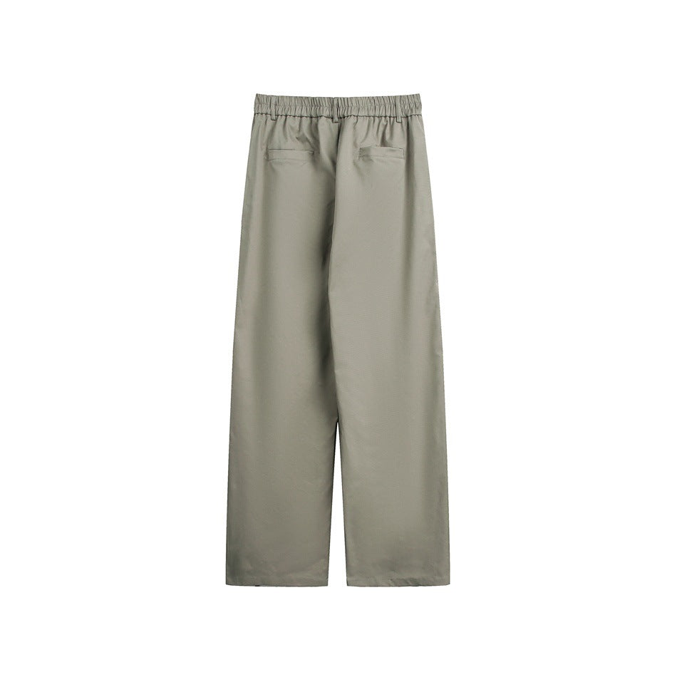 Gray-green wide-leg trousers shown from the back, with an elastic waistband and two welt pockets.