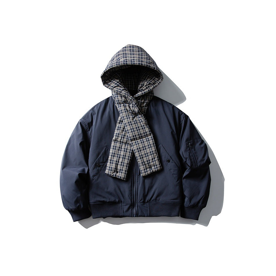 Navy blue bomber-style jacket with plaid hood and plaid scarf panel crossed over the front, flat lay