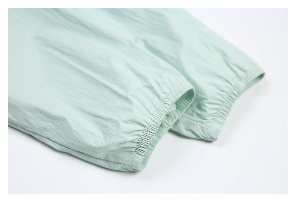 Close-up of the pale mint jacket's elasticized sleeve cuffs.