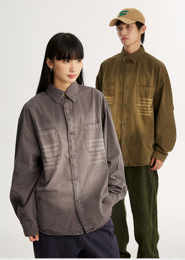 Two models wearing oversized washed button-up shirts in misty purple and rust with chest pockets