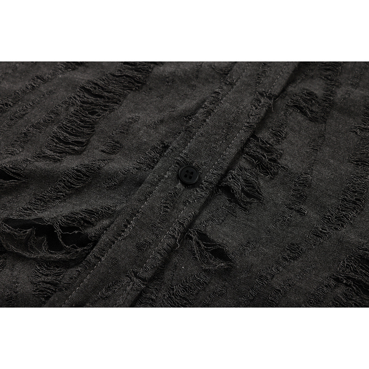 Close-up of a black button on the charcoal shirt's distressed striped front.