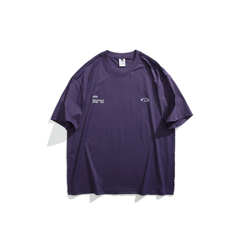 Front view of a purple oversized crew-neck T-shirt with small light chest text and an emblem.