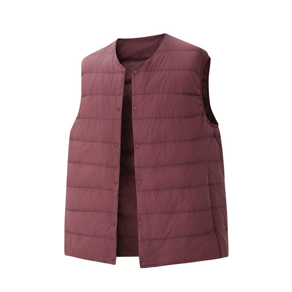 Dusty rose sleeveless quilted vest with a round neckline and snap-button front.