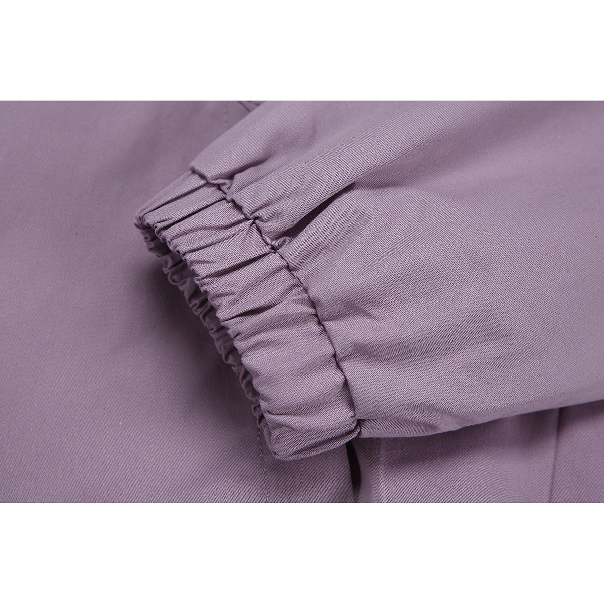 Close-up of a lavender jacket sleeve with a gathered elastic cuff.