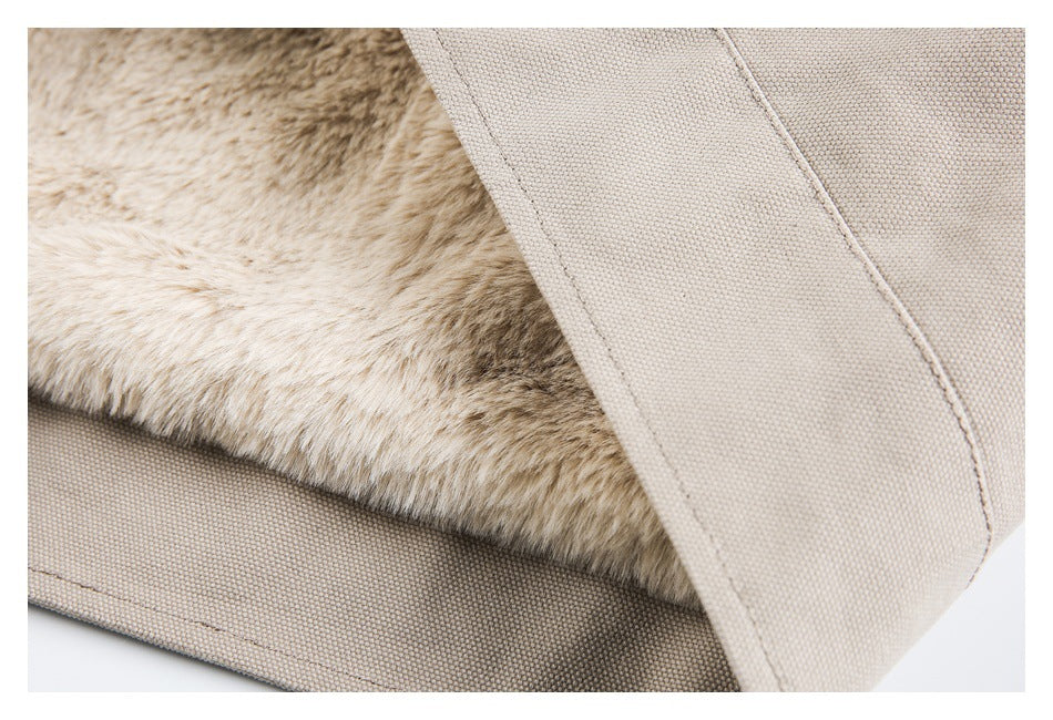 Close-up showing beige garment fabric and a strip of plush tan faux-fur lining.