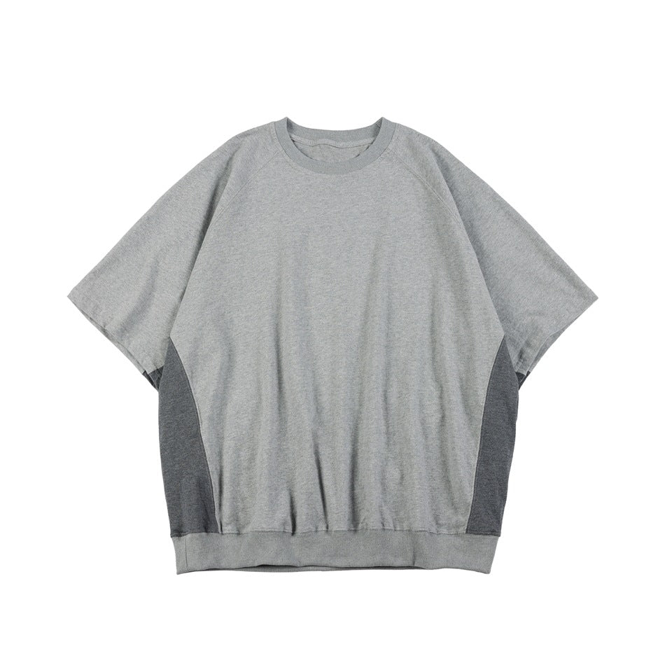 Gray short-sleeve raglan crew neck top with darker gray side panels and ribbed hem, front flat view