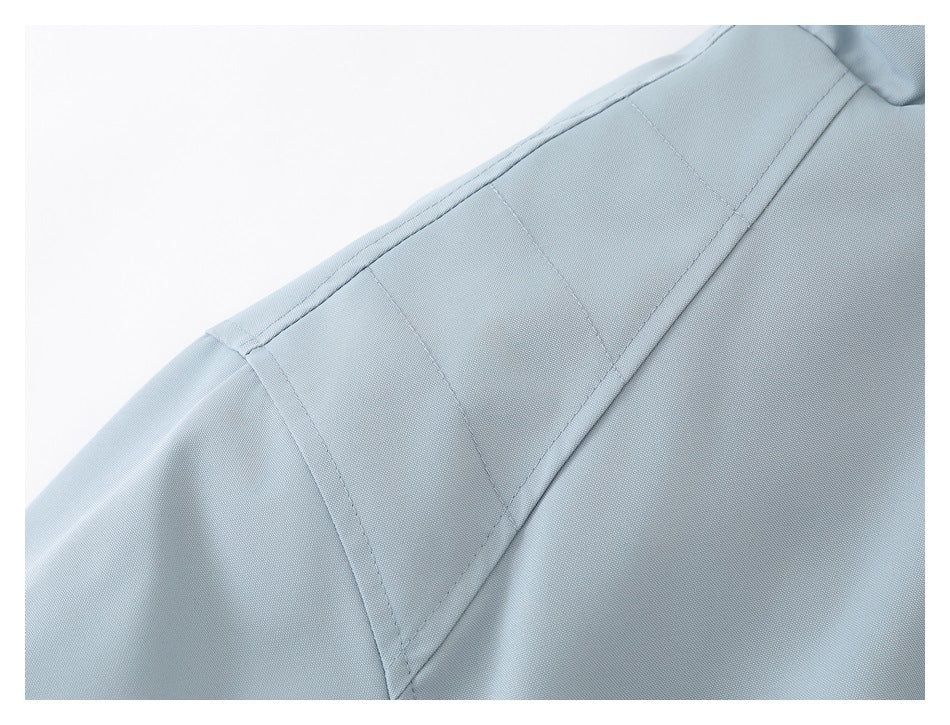 Close-up of the jacket's shoulder seam and sleeve construction.