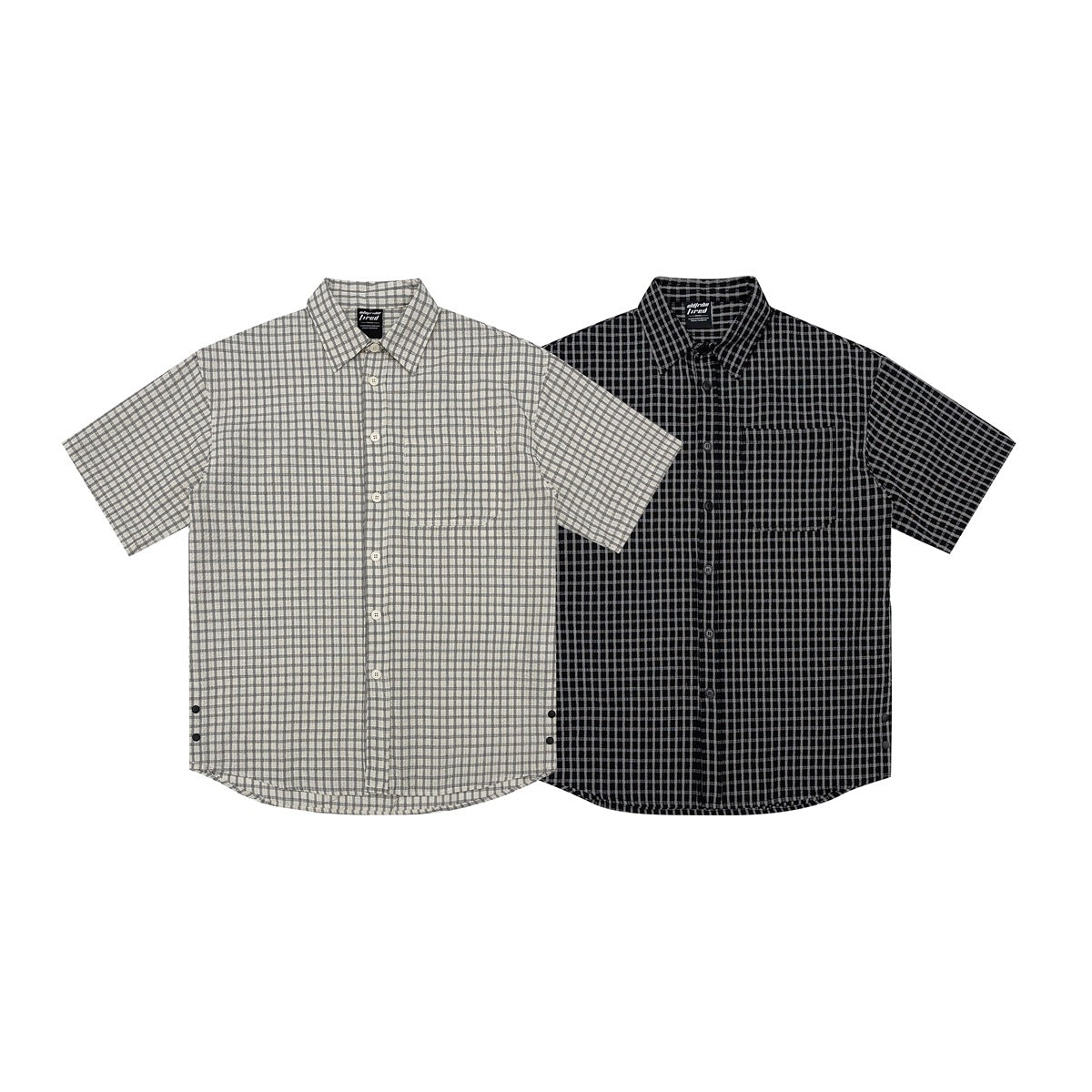 Two short-sleeve button-up shirts shown from the front: one light gray check and one black check.