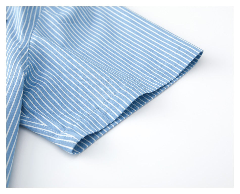 Close-up of the blue-and-white striped shirt's short sleeve and neatly stitched hem.