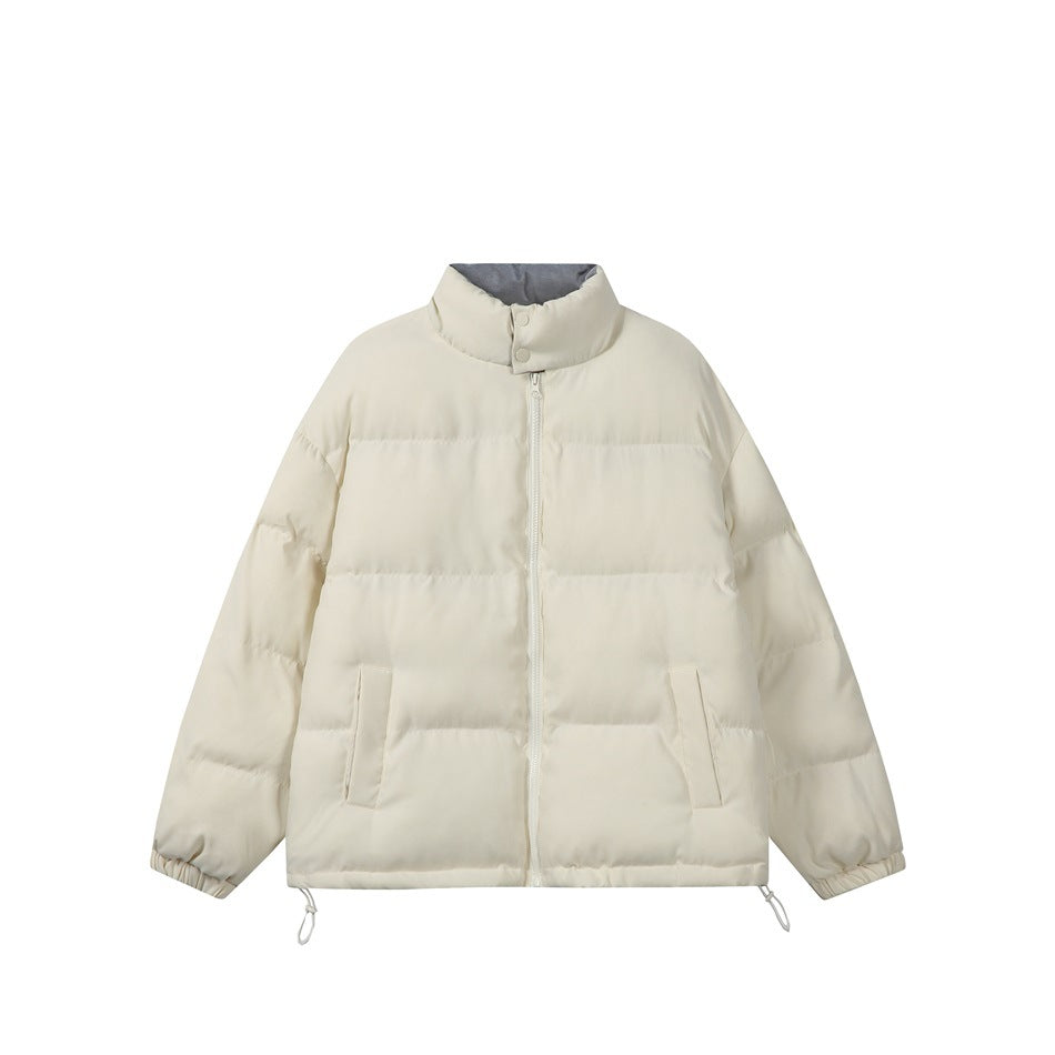 Beige quilted puffer jacket with stand collar, front zip, pockets, elastic cuffs and hem toggles, flat view