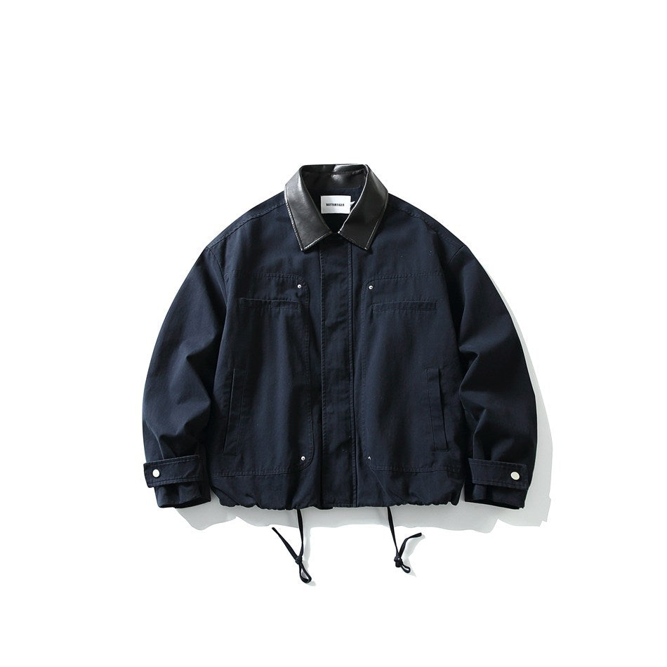Navy blue jacket with black contrast collar, front placket, chest and side pockets, cuff snaps and drawstring hem, flat view