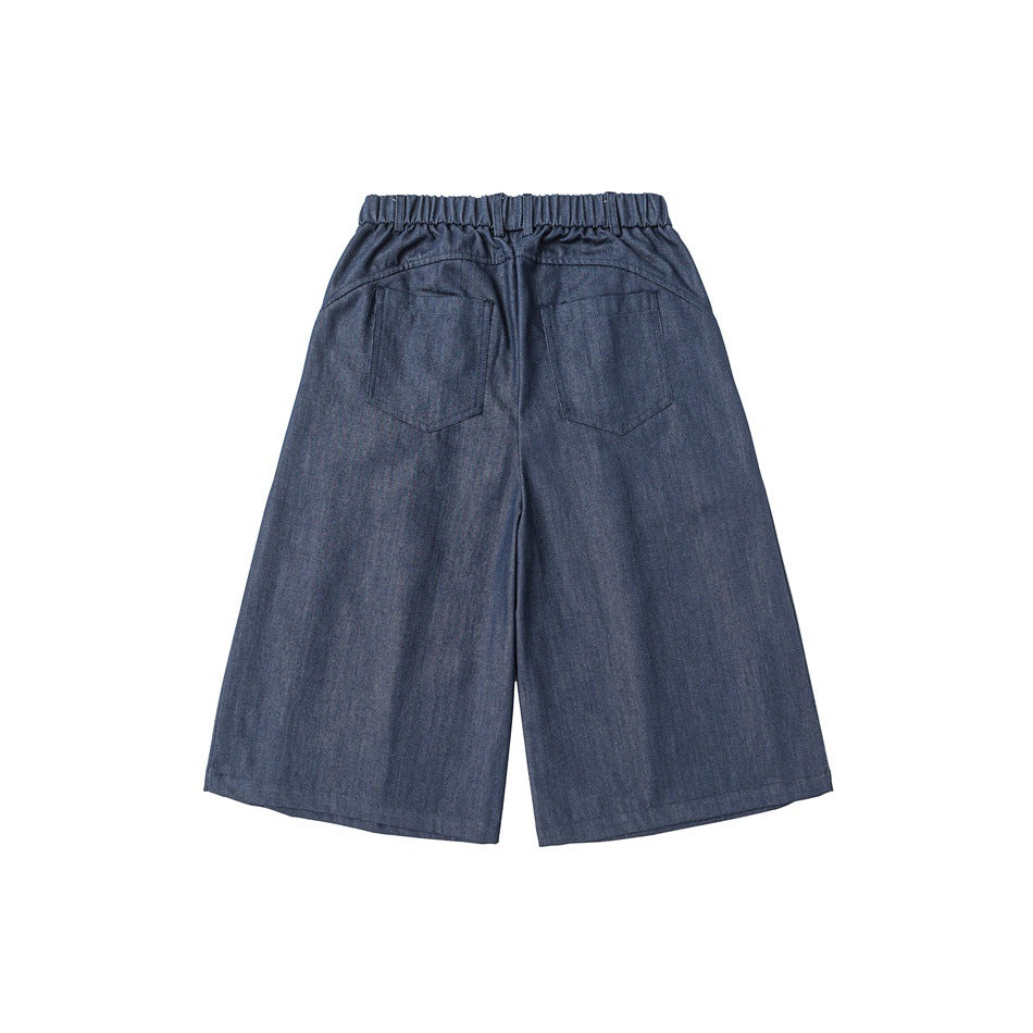 Back view of navy wide-leg shorts with a gathered waistband and two rear pockets.