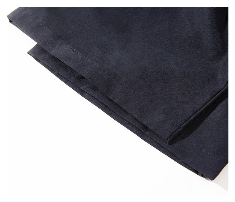Close-up of the navy shirt's double-layered hem and stitched edge.