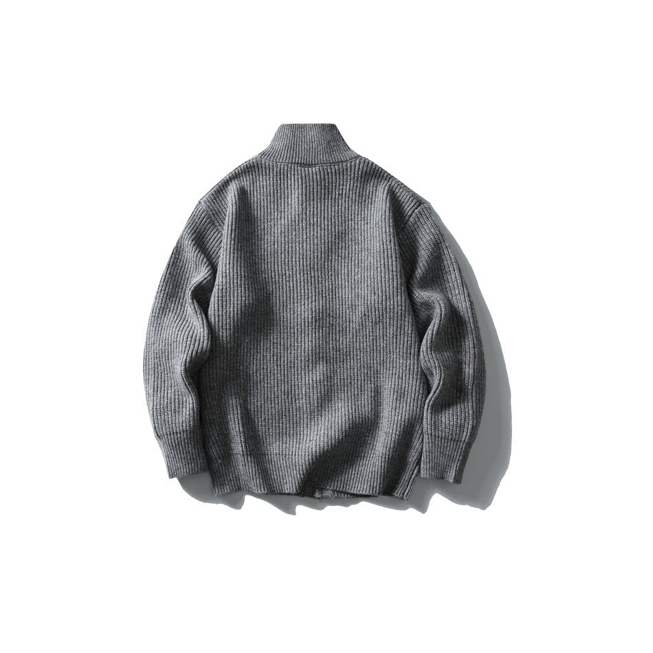 Back view of gray ribbed knit sweater with funnel collar, flat lay