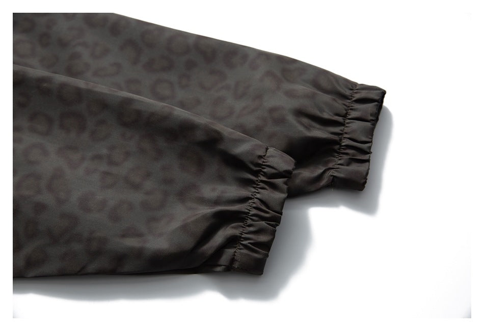 Close-up of the jacket's leopard-print sleeves and gathered elastic cuffs.