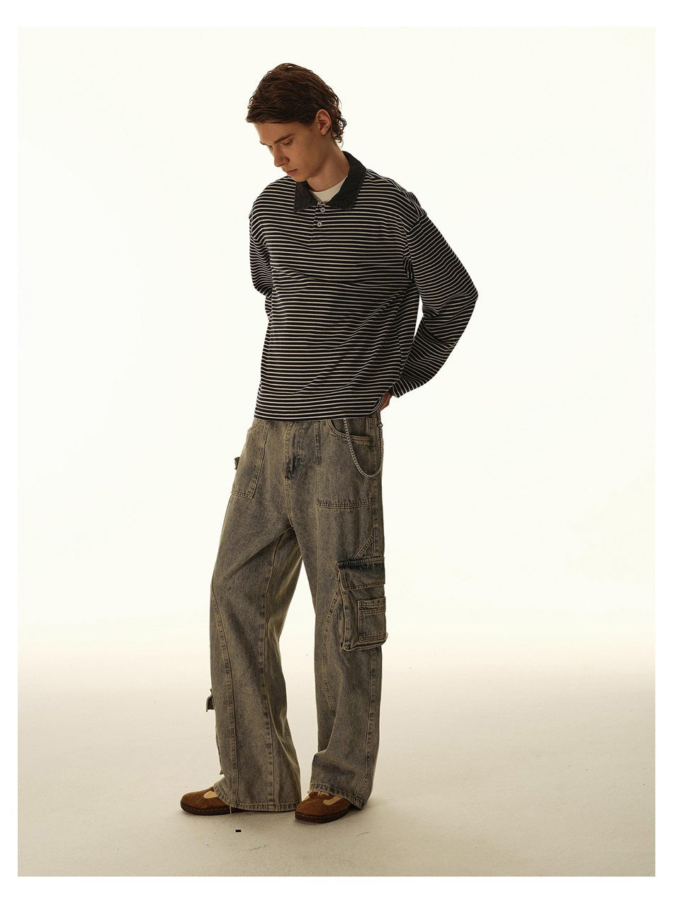 Model wearing a black-and-cream striped long-sleeve polo and loose gray cargo jeans, looking down.