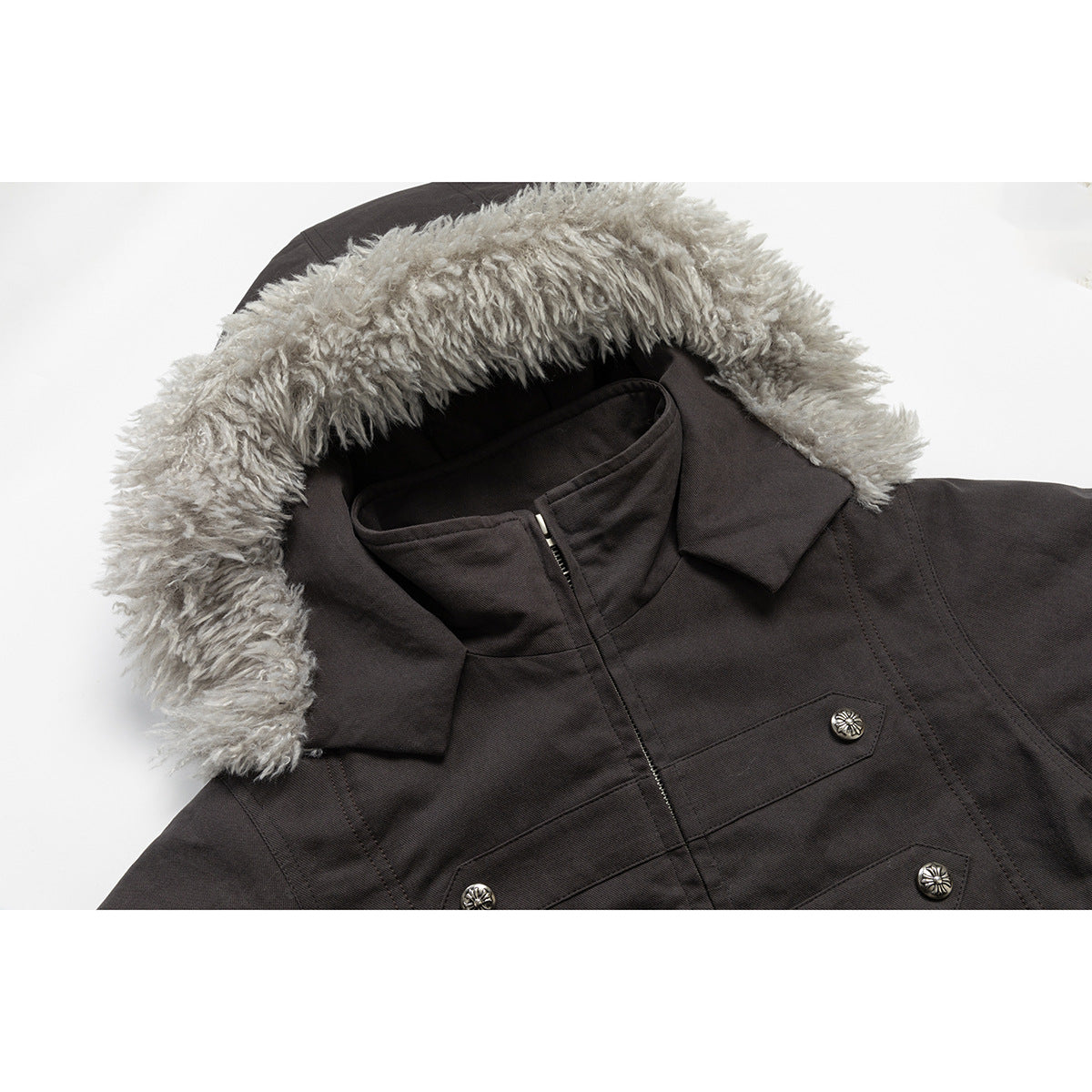 Close-up of the parka's gray fur-trimmed hood, high collar, zipper and decorative chest buttons.