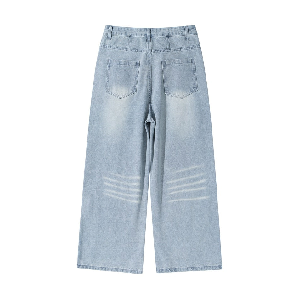 Back view of light blue washed wide-leg jeans with two patch pockets and faded streaks below the seat
