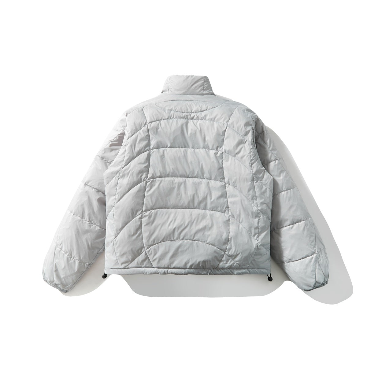 Back view of a light gray quilted jacket with a high collar, curved stitching, and adjustable hem cords.