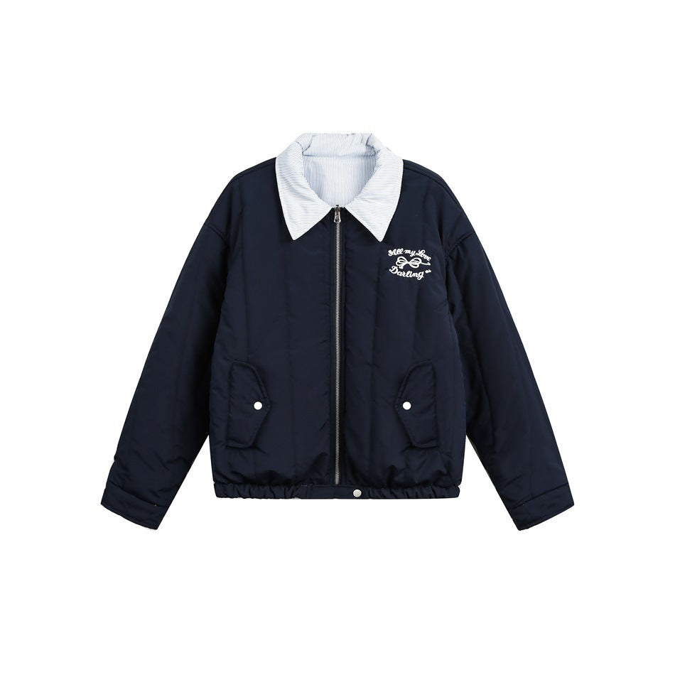 Front view of a navy jacket with a light pinstriped pointed collar, zip closure and embroidered chest lettering.