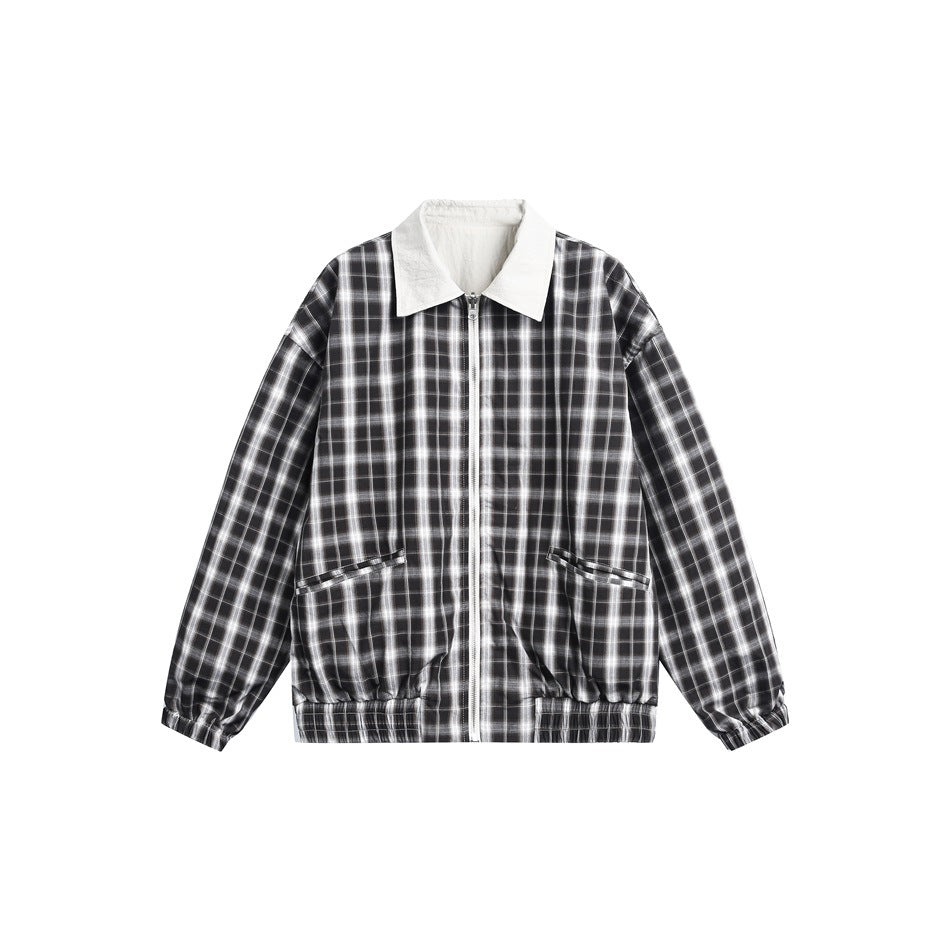 Front view of a black-and-white plaid zip jacket with a cream collar, slanted pockets, and gathered cuffs and hem.