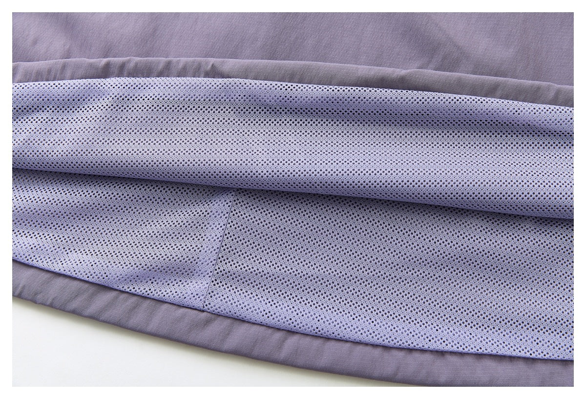 Close-up of the skirt’s pale mesh lining inside the muted purple outer fabric.