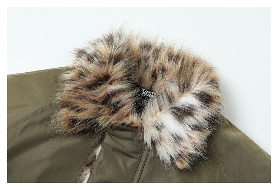Close-up of the jacket’s fluffy tan, cream, and dark-brown collar against olive fabric.