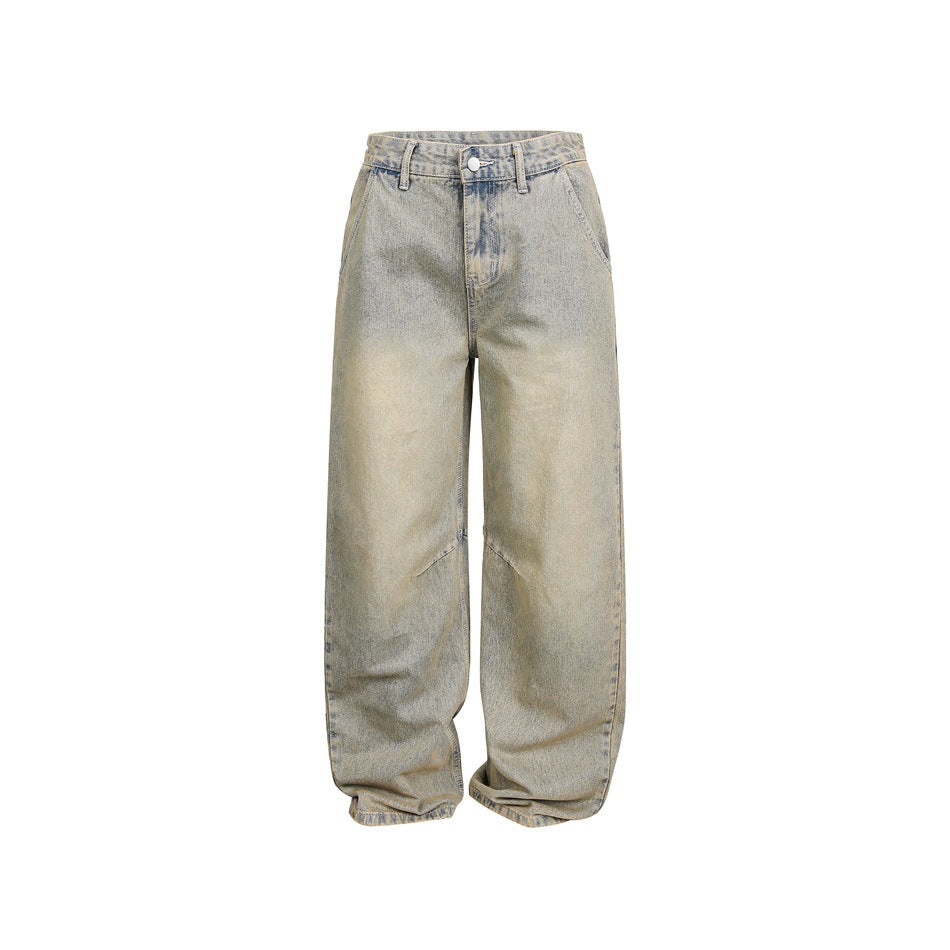 Front view of faded light blue wide-leg jeans with tan vintage wash, belt loops, button fly and angled knee seams