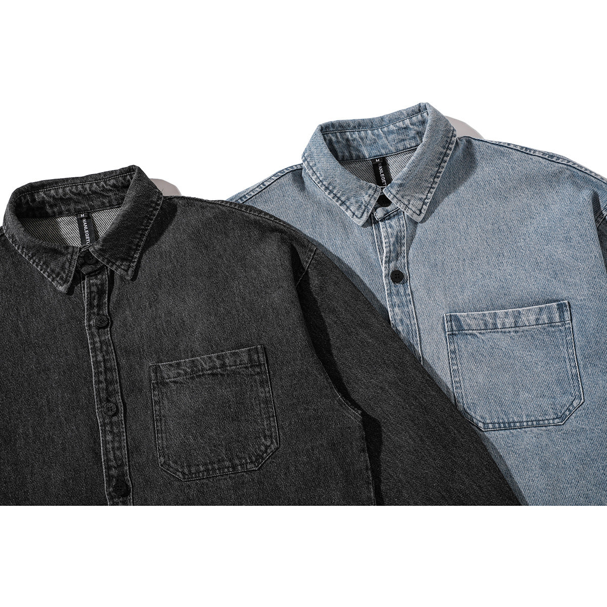 Two denim button-up shirts shown from the front: charcoal black and light blue, each with a chest pocket.