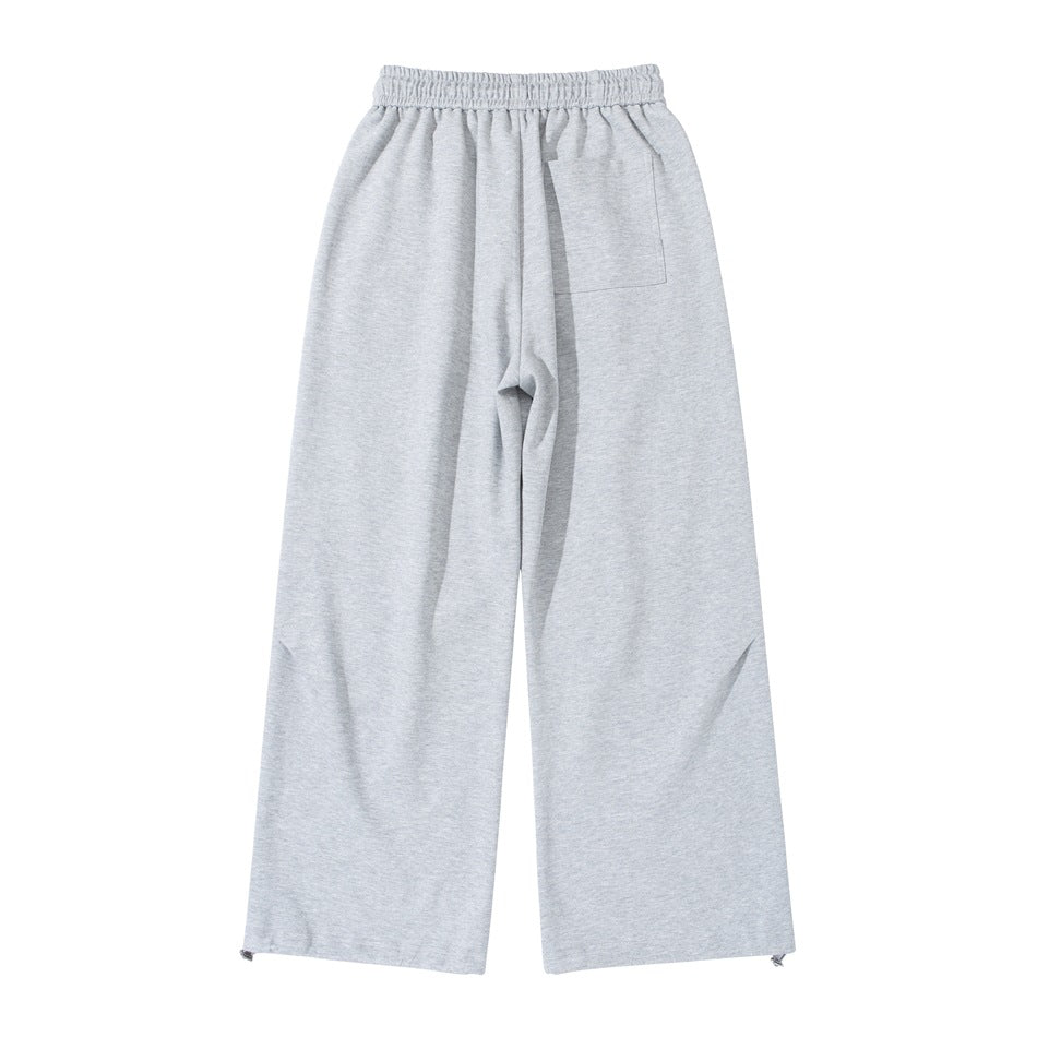 Back view of light heather gray wide-leg sweatpants with elastic waist, patch pocket and hem toggles