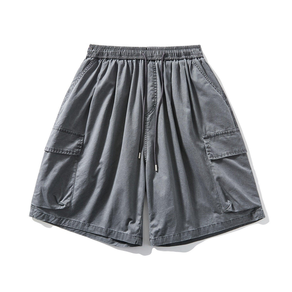 Dark gray wide-leg cargo shorts with elastic drawstring waist and large side flap pockets, flat lay front view