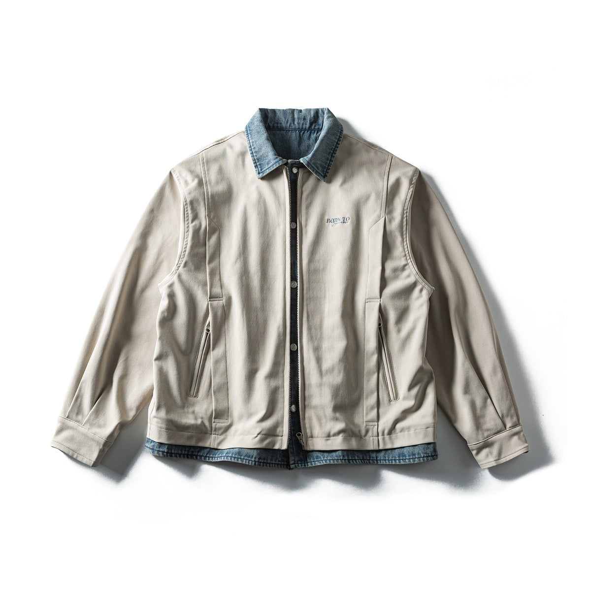 Off-white zip-front jacket with a light-blue denim collar and denim hem layer, flat lay front view