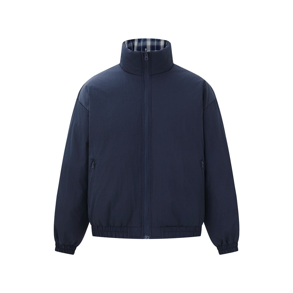 Navy blue padded stand-collar jacket, front view, zipped, with zippered pockets and elastic cuffs and hem