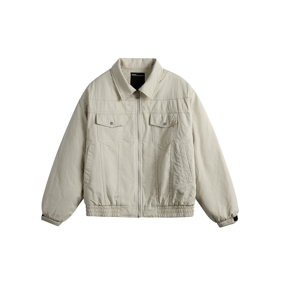 Beige-gray collared zip-front jacket with chest flap pockets and elasticized hem, flat lay front view