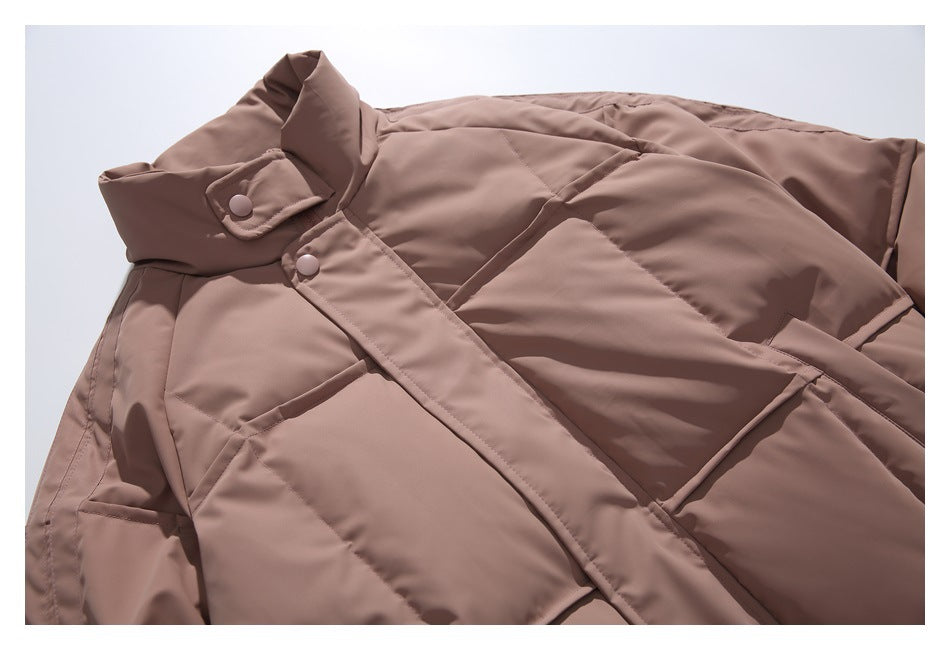 Close-up of the dusty mauve jacket's padded collar, snap closure and quilted front.