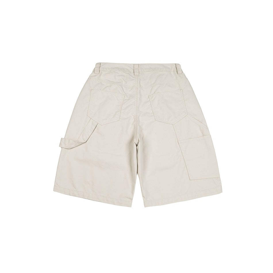 Back view of cream wide-leg utility shorts with two rear pockets and large cargo pockets on the legs.