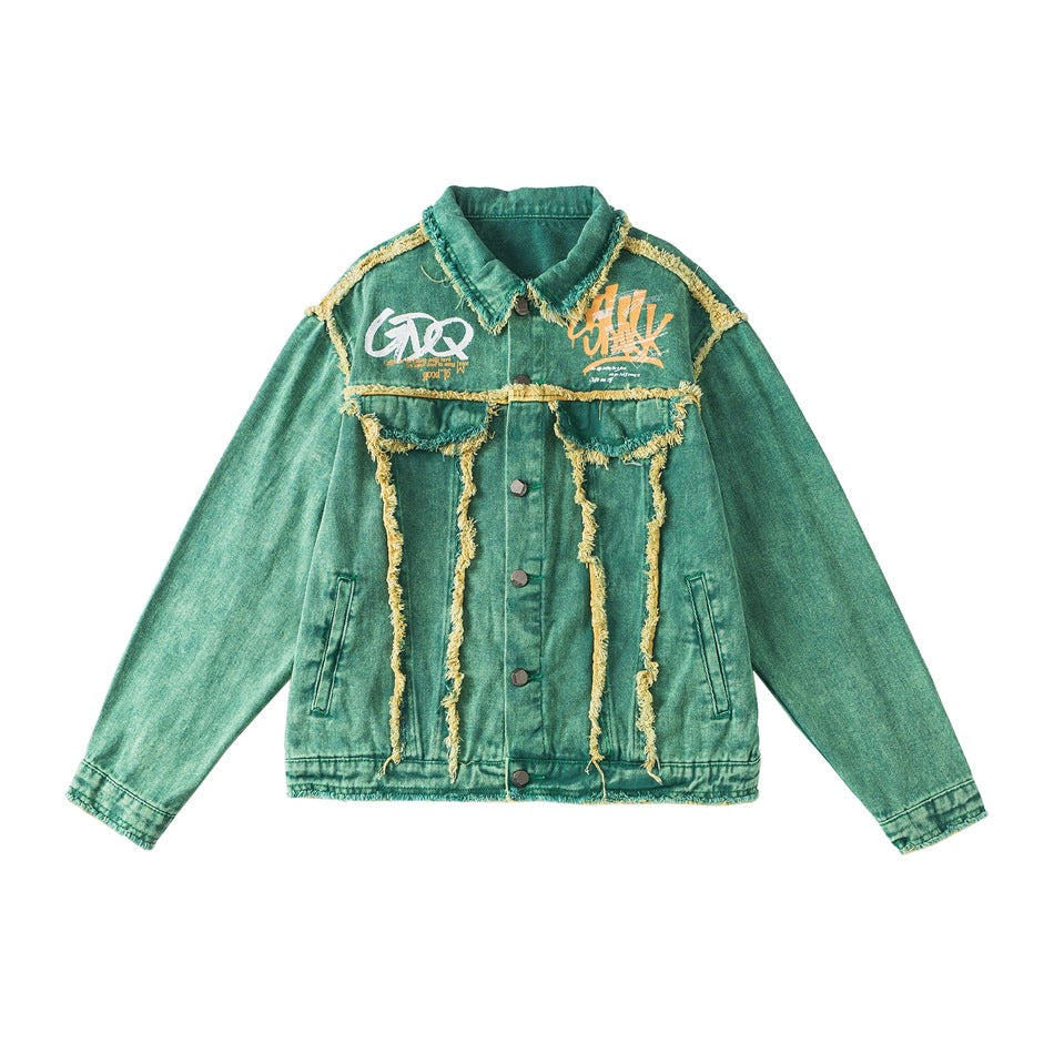 Green washed denim-look jacket with frayed yellow trim, button front, flap pockets and graffiti chest prints, flat lay