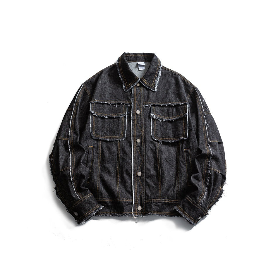 Black washed denim-style jacket with frayed raw edges, chest flap pockets and snap buttons, flat lay front view