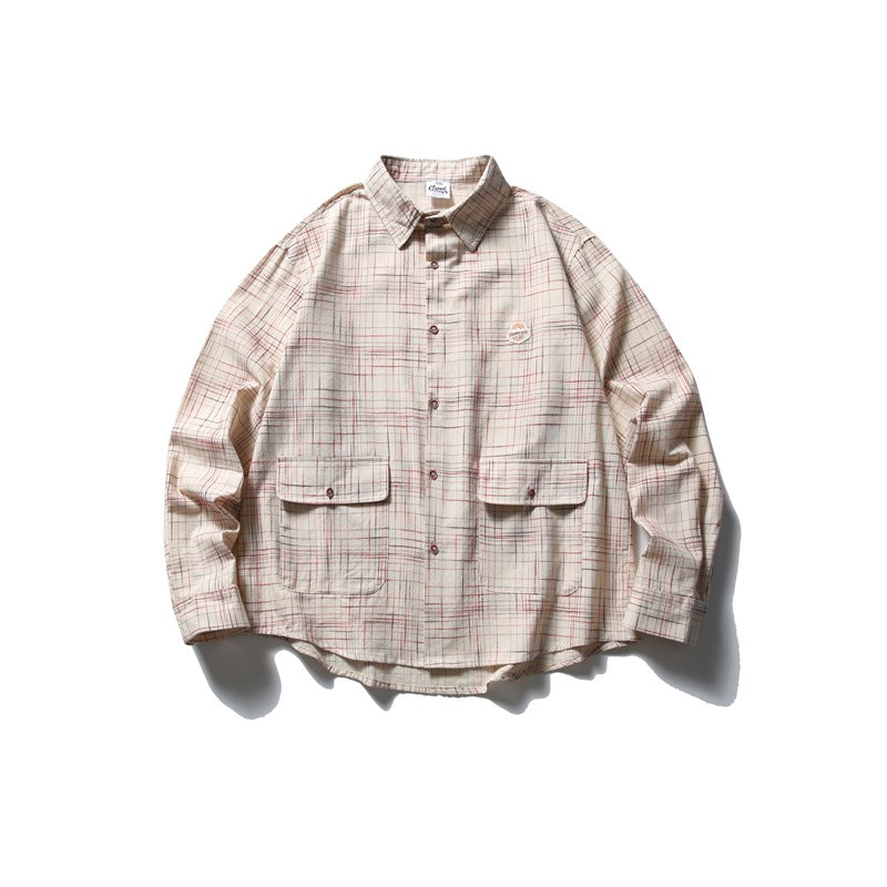 Beige plaid long-sleeve shirt with chest flap pockets and button placket, laid flat with a shadow