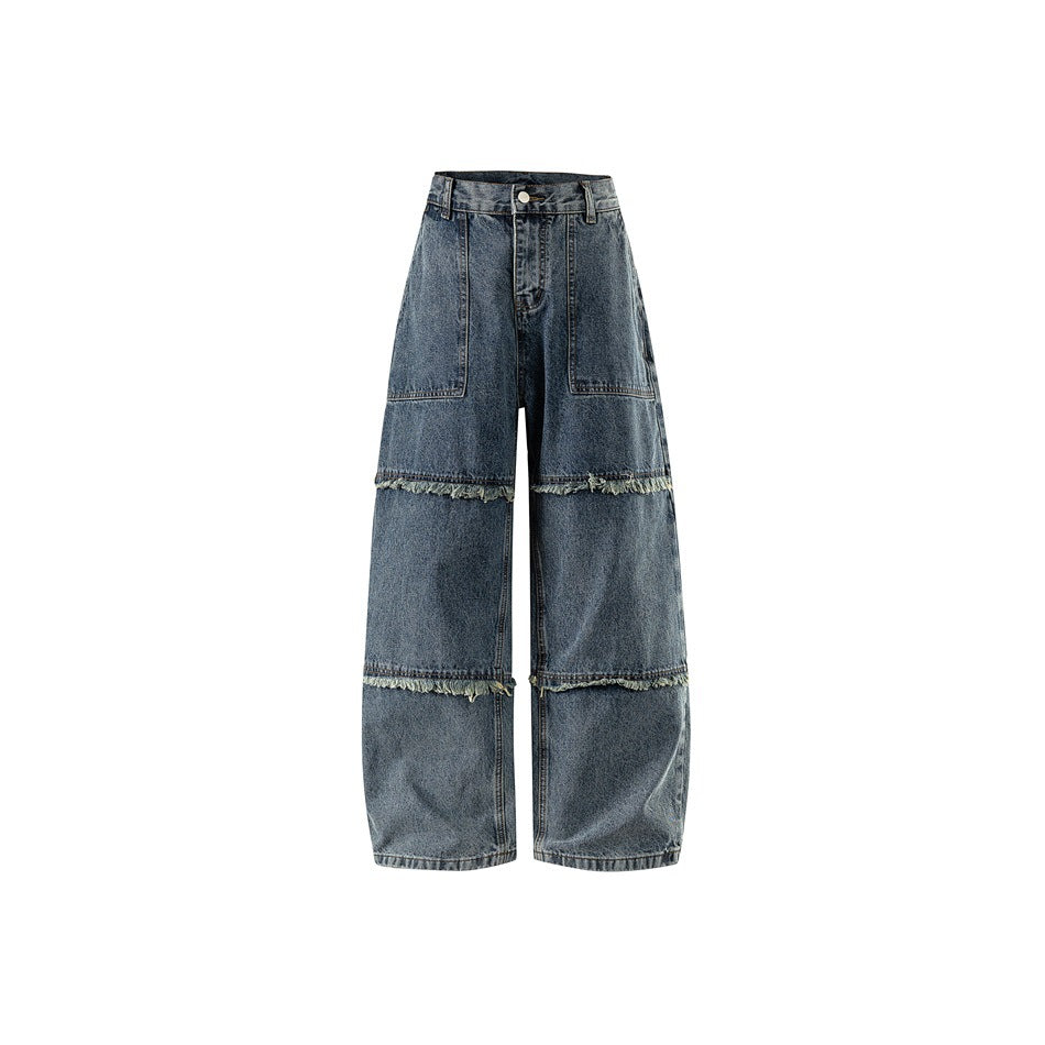 Front view of washed blue wide-leg jeans with patch pockets and frayed horizontal seam bands on the legs