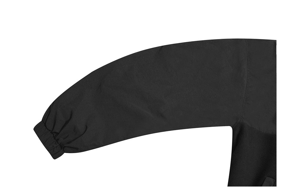 Close-up of a black sleeve with a gathered elastic cuff.